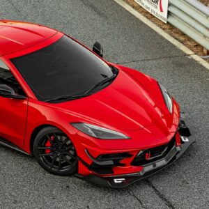 Top view of a Corvette C8 with carbon fiber splitter on the track.